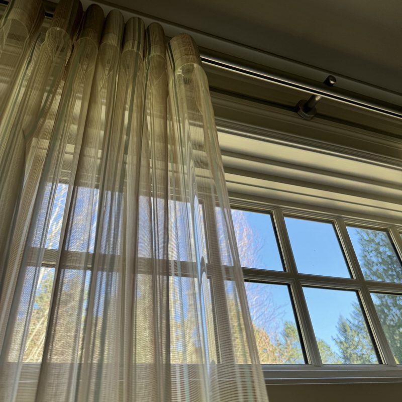 2026 PNW window covering trends — sheer custom drapery filtering soft sunlight across a multi-pane window
